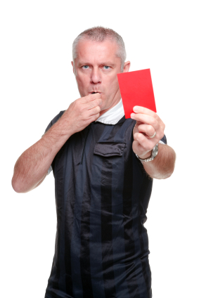Football referee showing the red card
